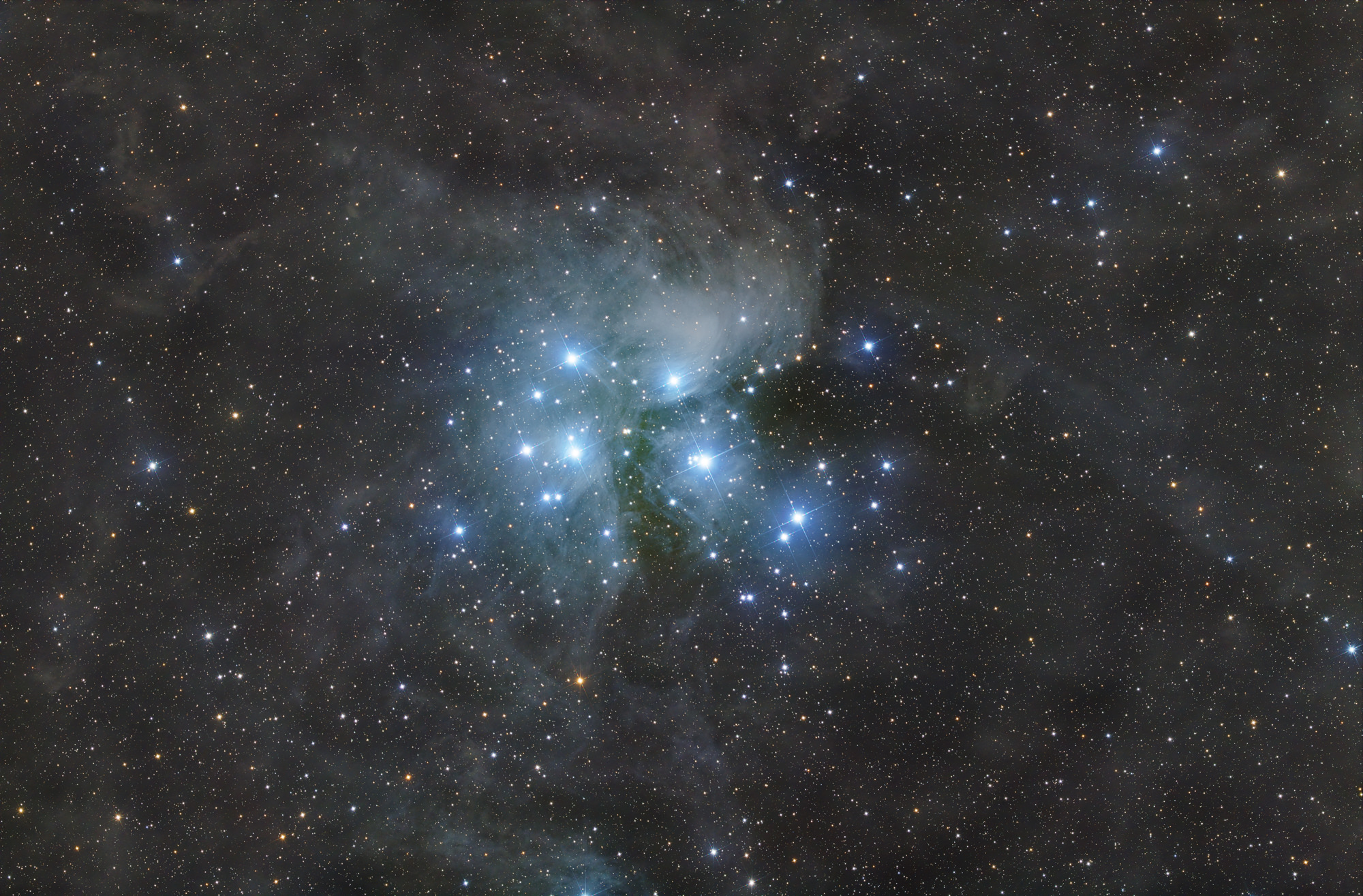The Pleiades, Messier 45 is an open star cluster containing middle-aged, hot B-type stars in the north-west of the constellation Taurus.